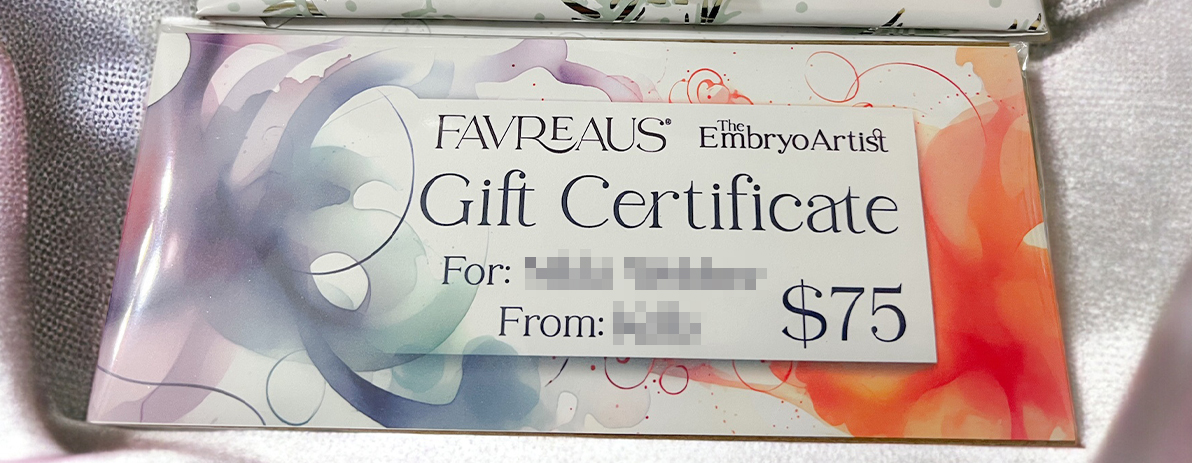 A watercolor gift certificate, wrapped in cello and wrapped as a gift.